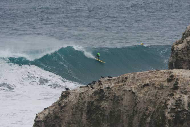 Taking off right behind the rocks there isn't much room for error at Punta de Lobos.
